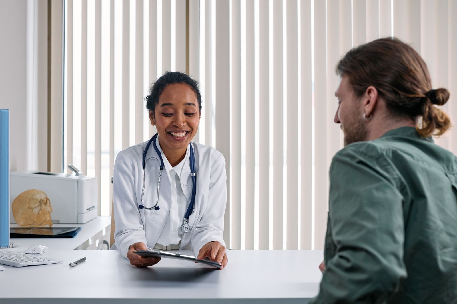 Healthcare professional discussing care with an adult patient